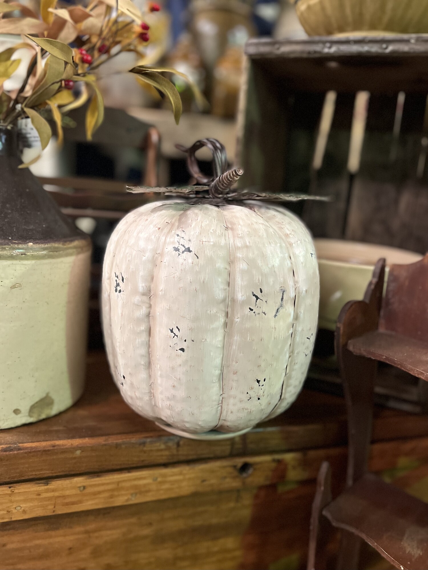 This beautiful distressed white pumpkin that stands 12 inches tall and is 9 inches wide would be a perfect addition to your fall decor and because its metal it can be used outdoors as well!