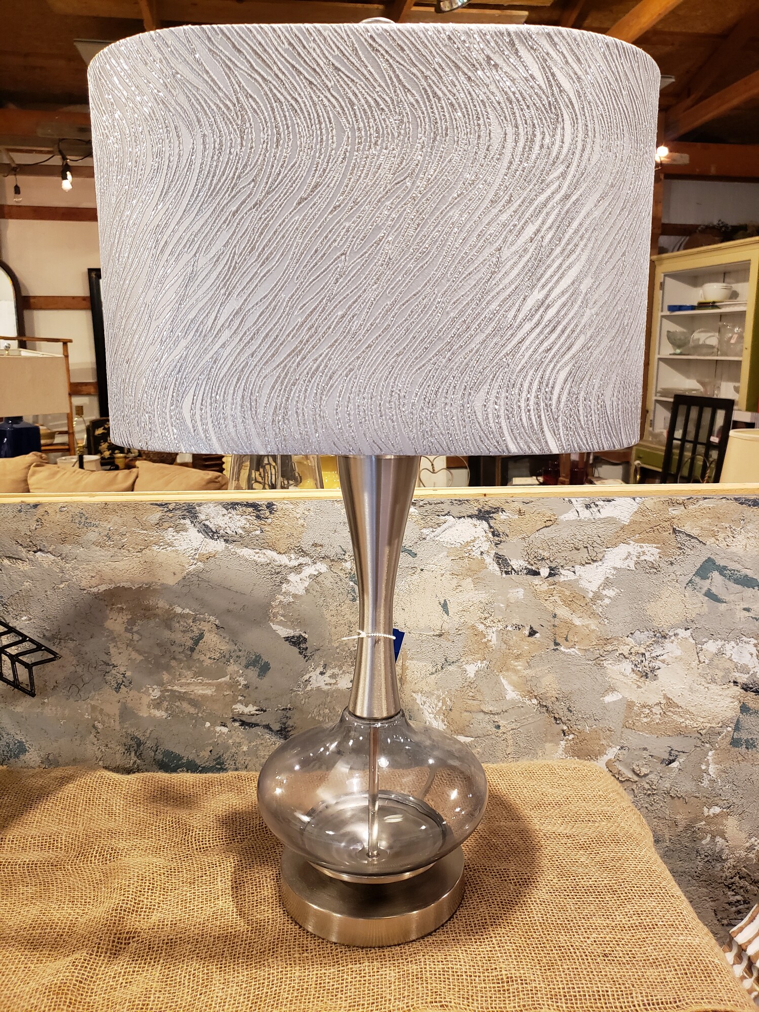 Lamp with Glass Bottom. Silver textured shade. 27in tall