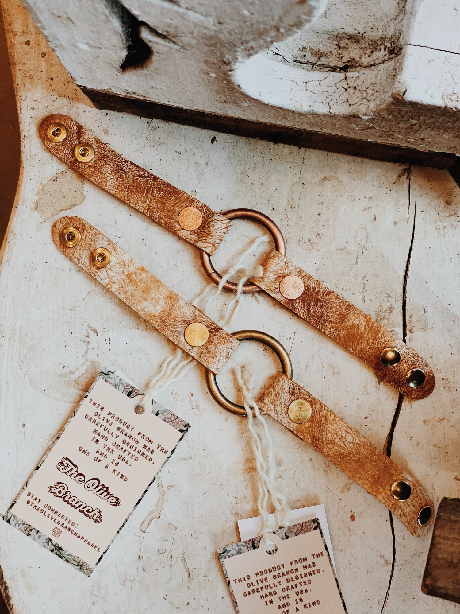 These handmade, genuine leather bracelets by The Olive Branch measure 9 inches in length, with two adjustable snaps. This artisan bracelet is available with copper hardware or brass hardware!