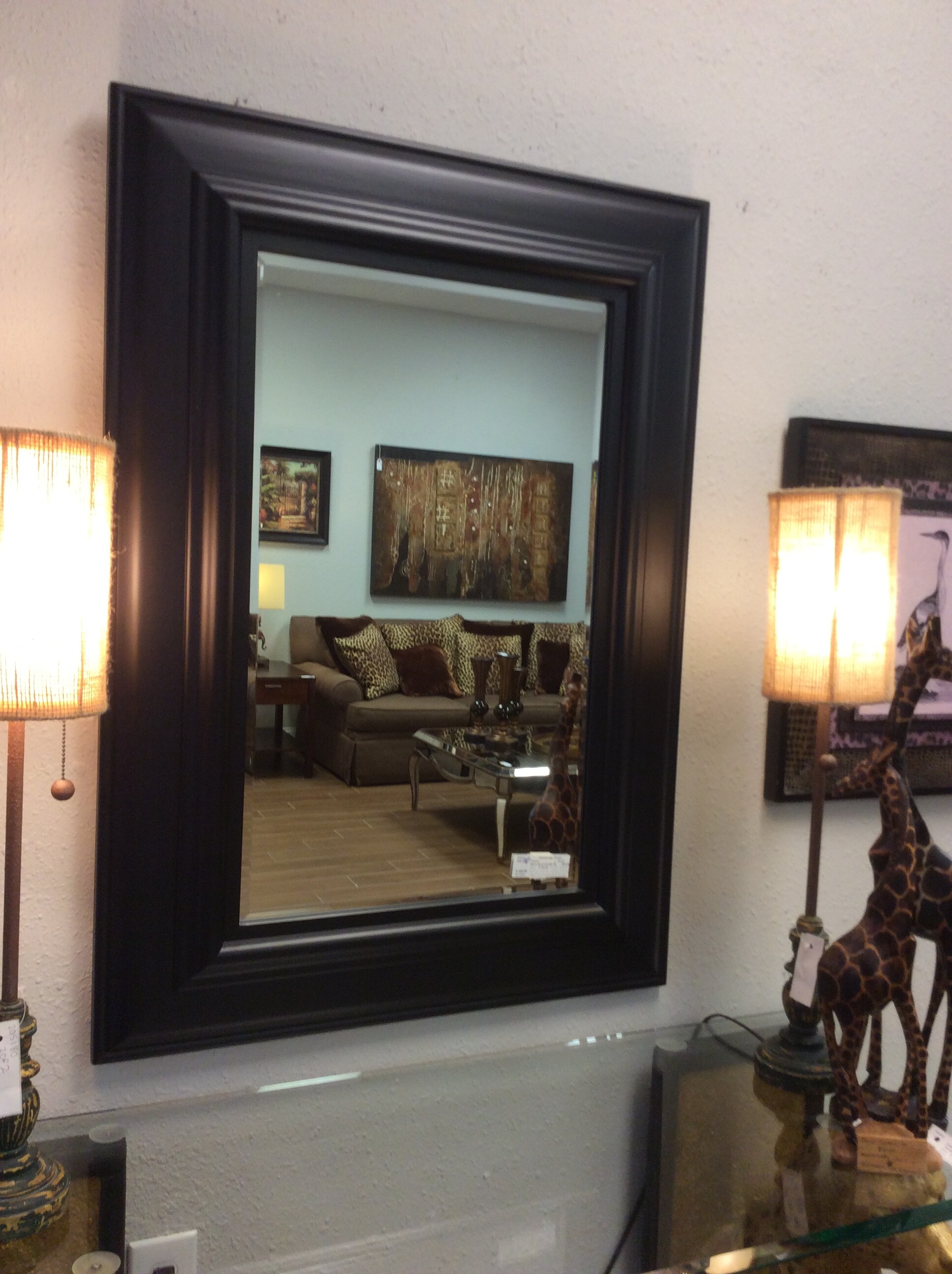 This is a Pottery Barn, Black and Beveled Glass Mirror.