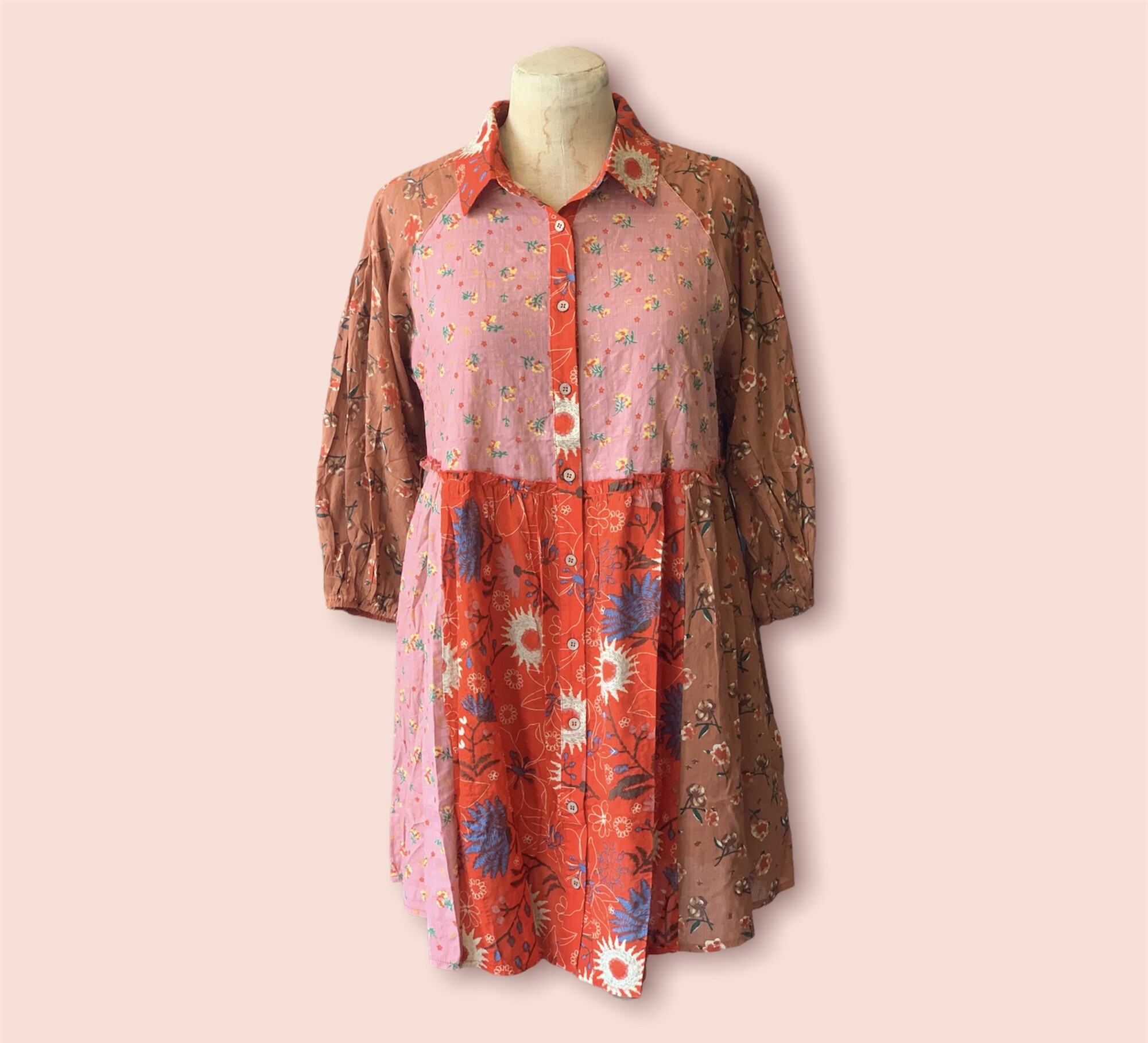 These fabulous dresses have a mix of floral patterns in browns, pinks, and reds! The collar and cinched wrists give this dress a more unique and fashionable look, perfect to throw on and go!