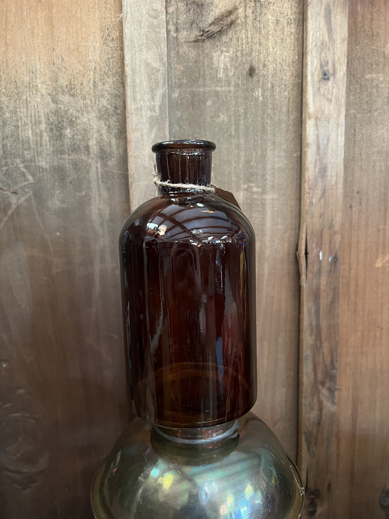 Small amber bottle measures measure 8 inches tall and looks beautiful with seasonl florals