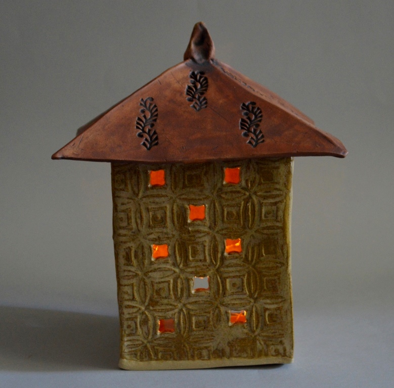 Patio Lantern
Pam Gray
Pottery
7x7x9
Stoneware lantern with removable roof.  Comes with strings of battery operated lights.  Recommend using only battery lights and not candles or other flame.
