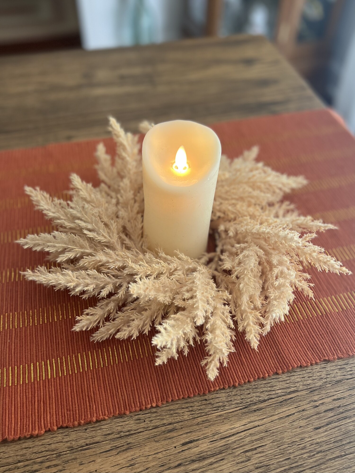 Add a touch of Boho with this beautiful Pampas Candle ring. It has a soft beige color which makes it perfect for any season and with any colors in your home.  Ring measures 13 inches outside diameter and 3.5 inner