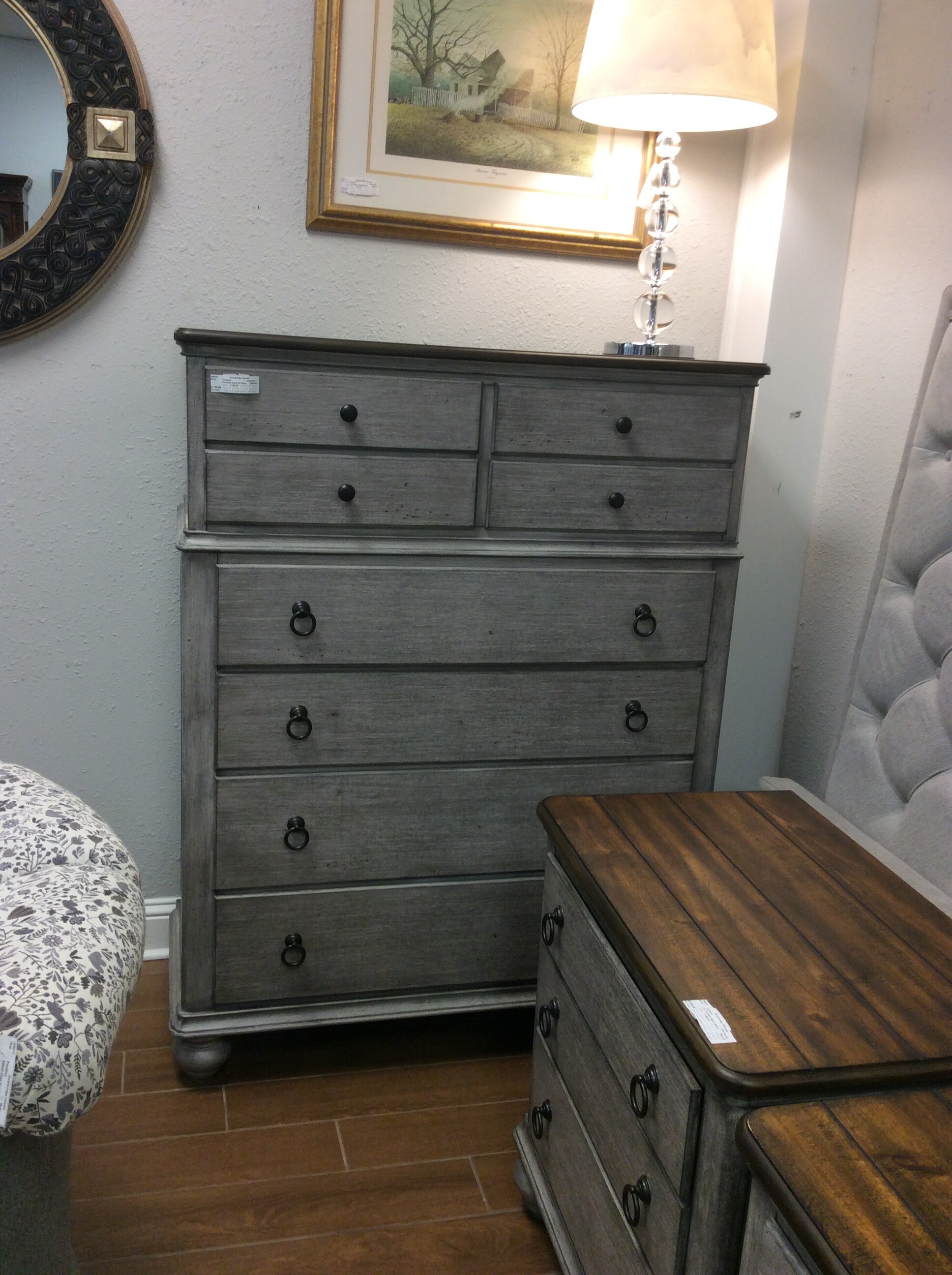 This is a beautiful, rustic gray with dark top, Flexsteel chest of drawers. This chest of drawers has 8 drawers.
