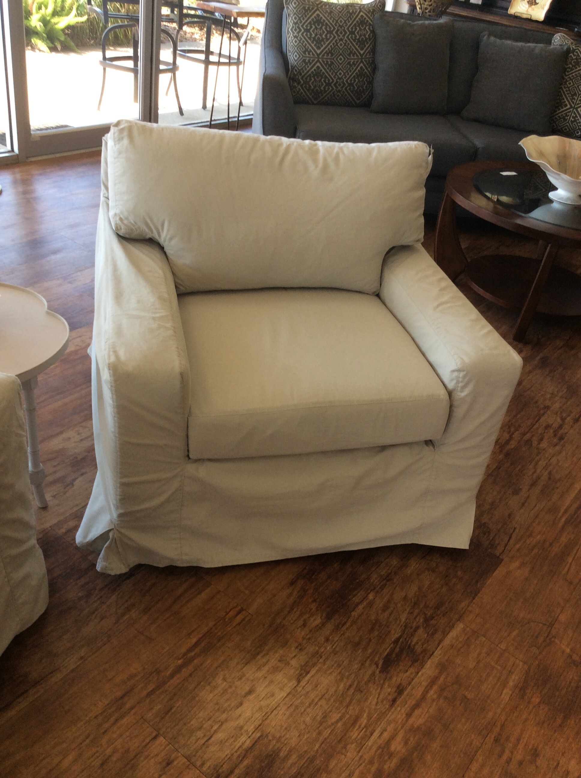 This is a beautiful, white slip covered oversized chair.