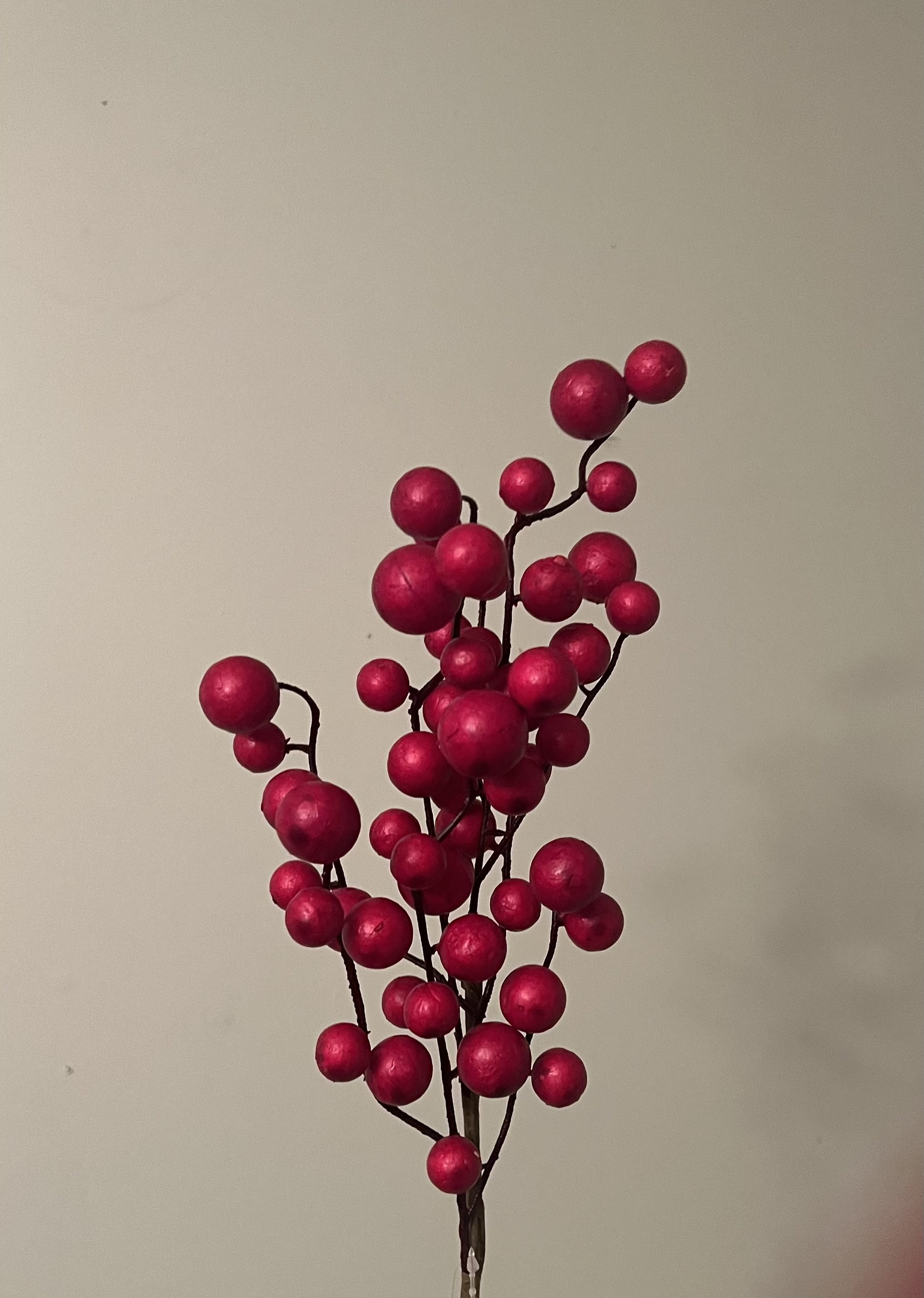 This Berry Stem is a holiday classic with its different sized berries on a brown floral wrapped stem measuring 17 inches tall. Add this beautiful stem to greenry for a warm and inviting arrangement