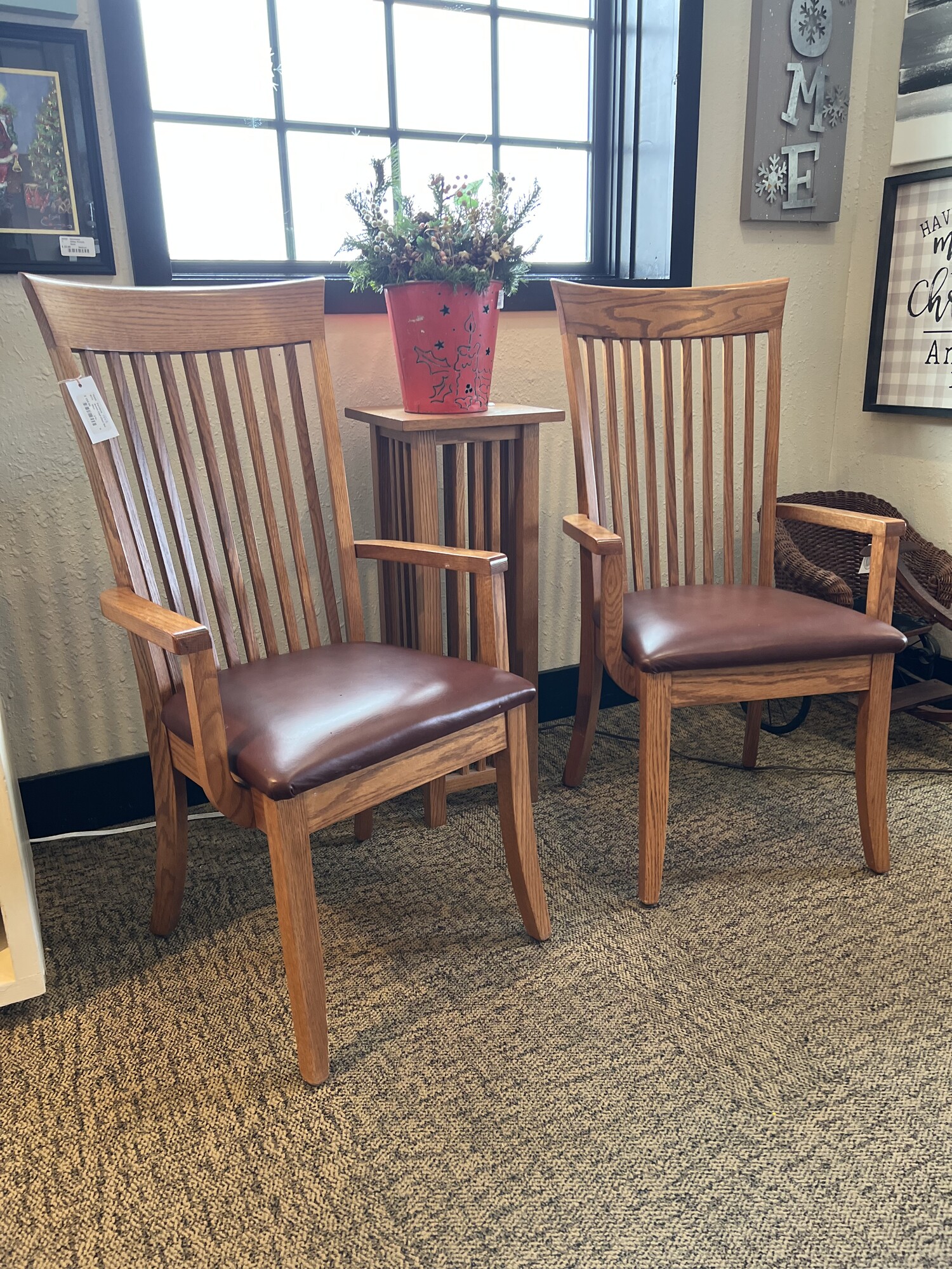 Amish made oak captain chair set.

Includes 2 pieces.

Beautifully hand crafted Amish made oak captain chairs with smooth brown leather cushions.

There are minor scuff marks and wear on the legs.

Each: 41 1/2in tall x 19in wide x 17in deep x 20in tall (seat to floor)