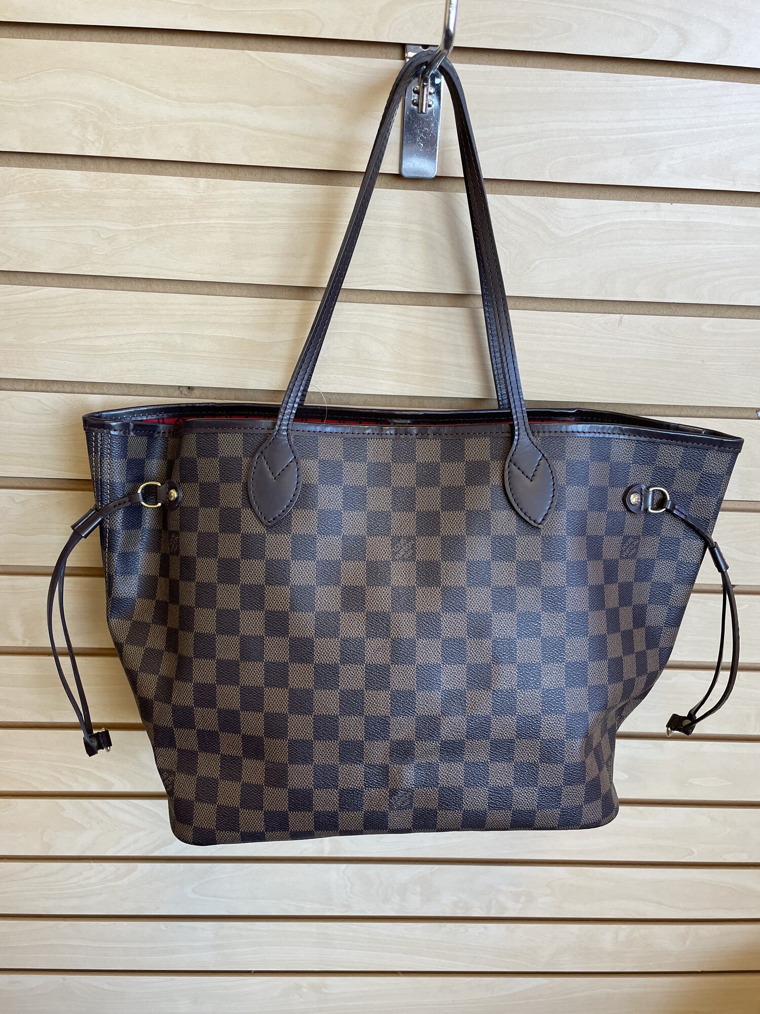 LV Damier Neverfull MM, Brown, Size: As Is
Damier Ebene Pattern, Brass Hardware, Dual Shoulder Straps, Leather Trim Embellishment, Canvas Lining With Staining On The Bottom Of The Lining & Single Interior Pocket, Clasp Closure at Top.

Details, Shoulder Strap Drop: 8.25 inches, Height: 11 inches, Width: 12.5 inches, Depth: 6.25 inches.
