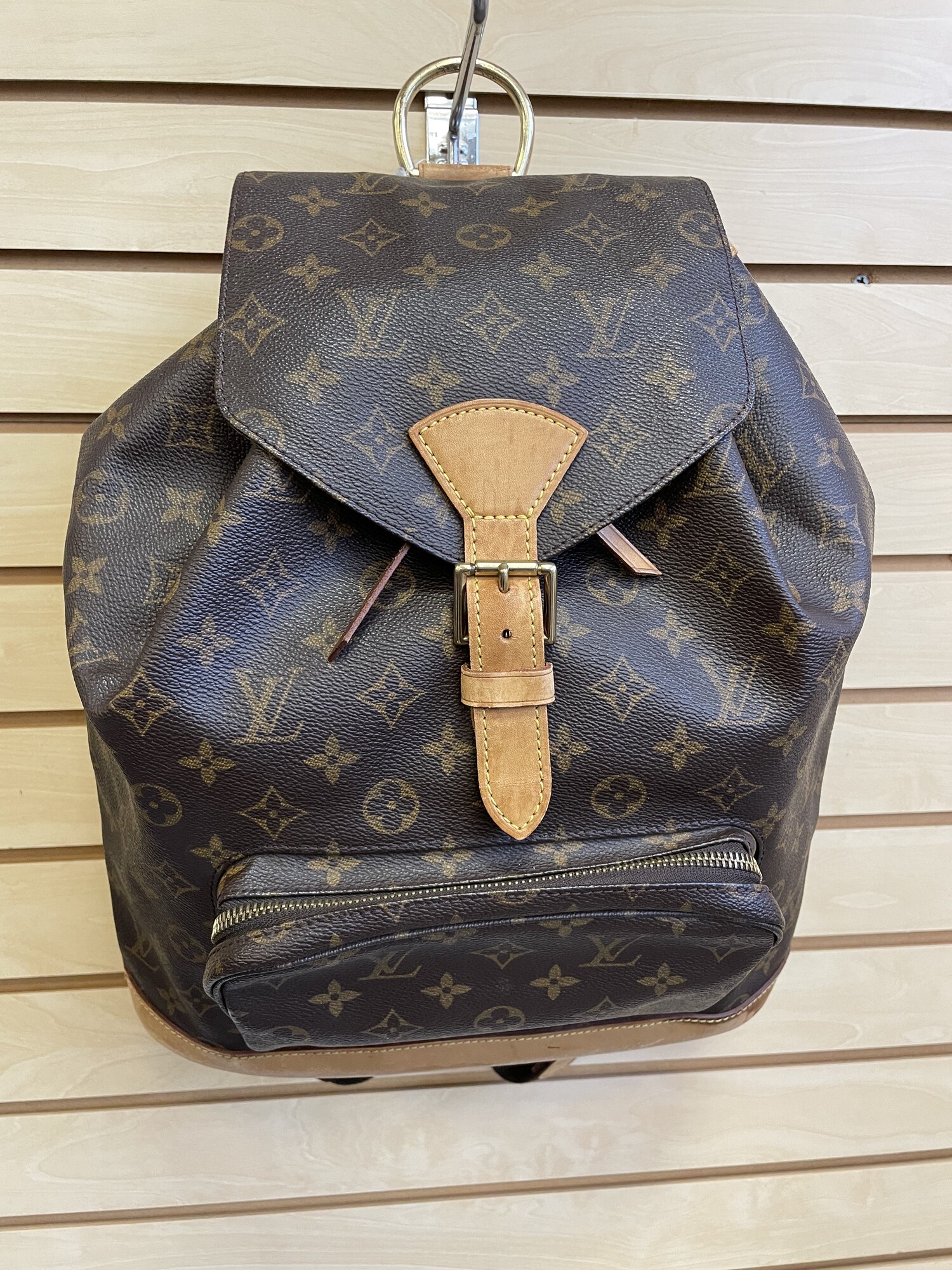 Louis Vuitton Canvas Montsouris Backpack As Is, Brown LV Logo Coated Canvas with Brown Canvas Lining, Fabric and Leather Straps, Leather Bottom with Water Stains and Cracks Along the Bottom and Sides, Leather Drawstring Opening (Some Wear, Cracking, and Water Stains on Piping) and Leather Piping and a Flap Cover (Stains on Fabric Under the Flap) with Leather Buckle Closure (Water Stains on Leather), Inside Pocket with Leather Opening, Gold Hardware with Some Tarnishing/Scraches

Size: Length: 12.2 inches, Heighth: 15.4 inches, Depth: 5.1 inches