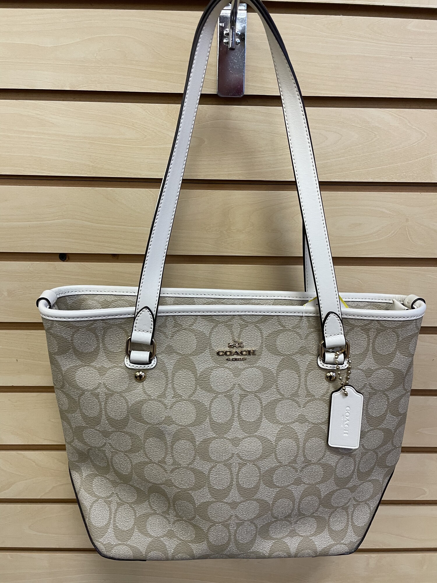Coach Purse, Khaki with Cream Accents and Coach (C) Design, Brown Lining, Gold Hardware, Coach Logo on Front and Zipper in Back, 1 Zippered Pocket and 1 Split Pocket, Size: 10 x 4 x 13 inches
