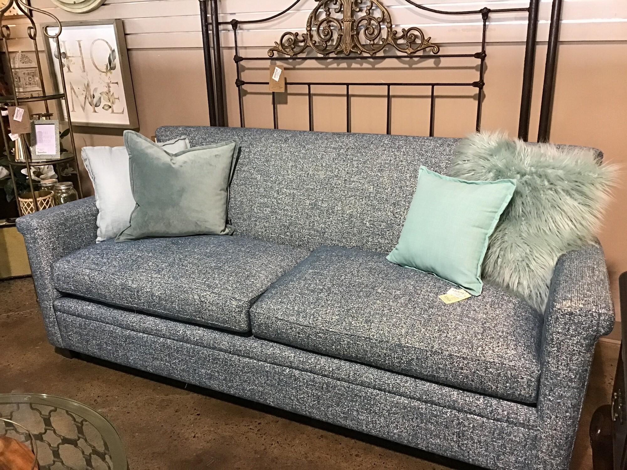 This beautiful two cushion sofa is in excellent condition and features a teal tweed fabric. The seat cushions are flippable and zip off for cleaning. This sofa is not only beautiful to look at, but is is comfortable, too!
Dimensions are 84 in x 36 in x 35 in