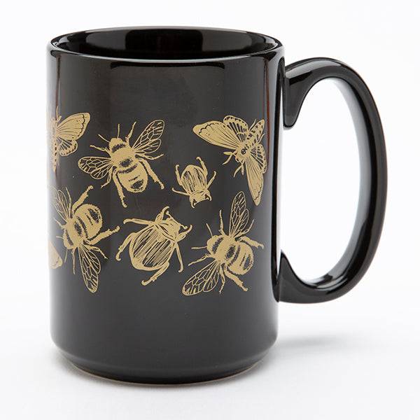 Insect Mug, Insect Ceramic Coffee Mug
SKU 3567
About this product

Insect coffee mug. Hand screen printed with bees, moths, and beetles. Perfect for your morning cup of coffee. Black mug with gold print. Print wraps around the mug. Top-rack dishwasher safe. Print won't wash off or fade. 15oz. mug. Select if you want them individually boxes or not. Blank Mug made in China, printed in the USA.
Details
•  Weight: 1 lb