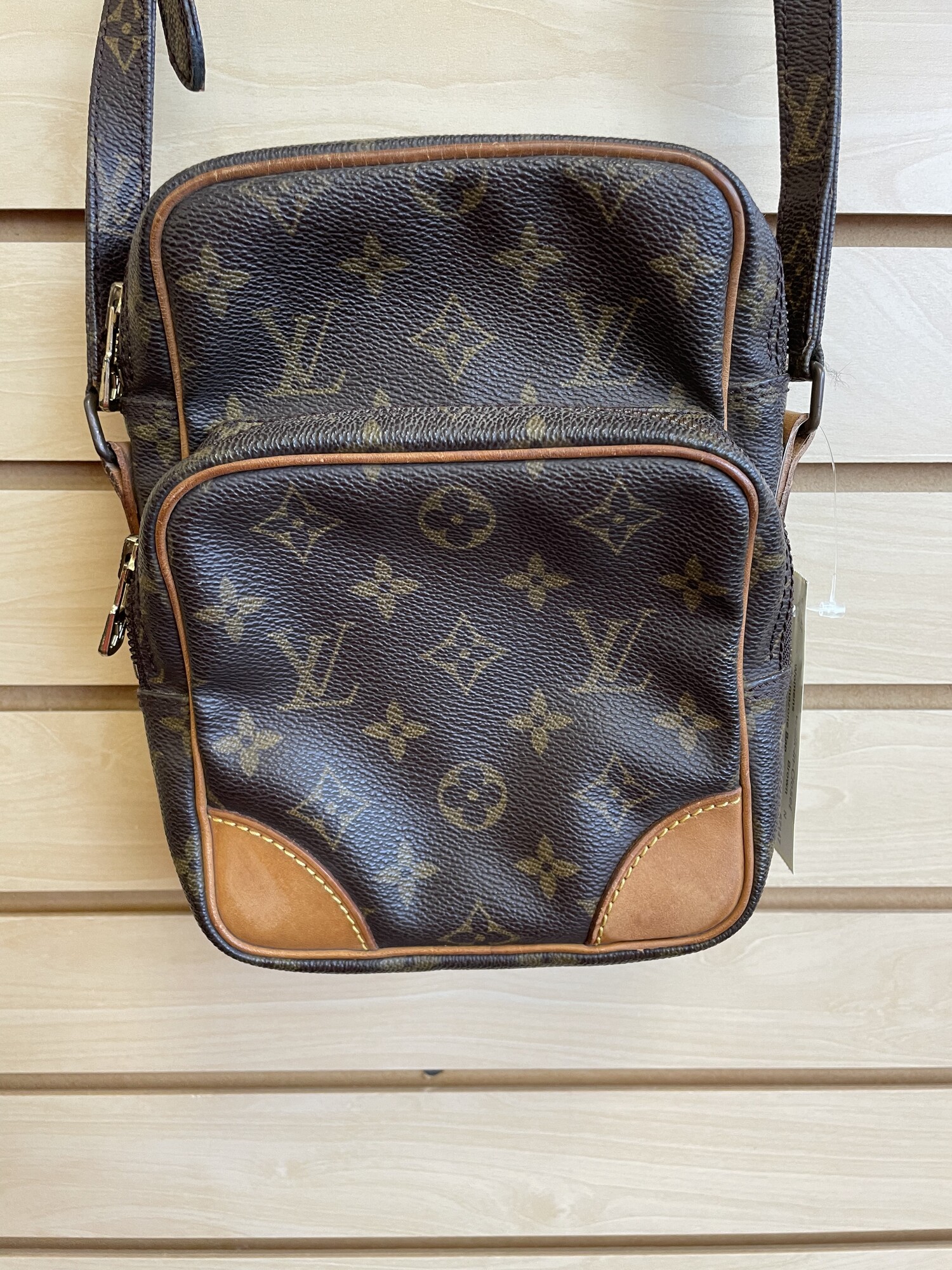 LV Amazone Bag, Brown with VL Monogram, Front and Back Pockets Have Very Few Interior Scratches, Back Pocket Has a Small Pouch, Some Watermarks and Fading on the Patches at Each Bottom Corner and the Shoulder Grip, Size: Base length: 5.75 in, Height: 8.25 in, Width: 3.5 in, Drop: 20.5 in