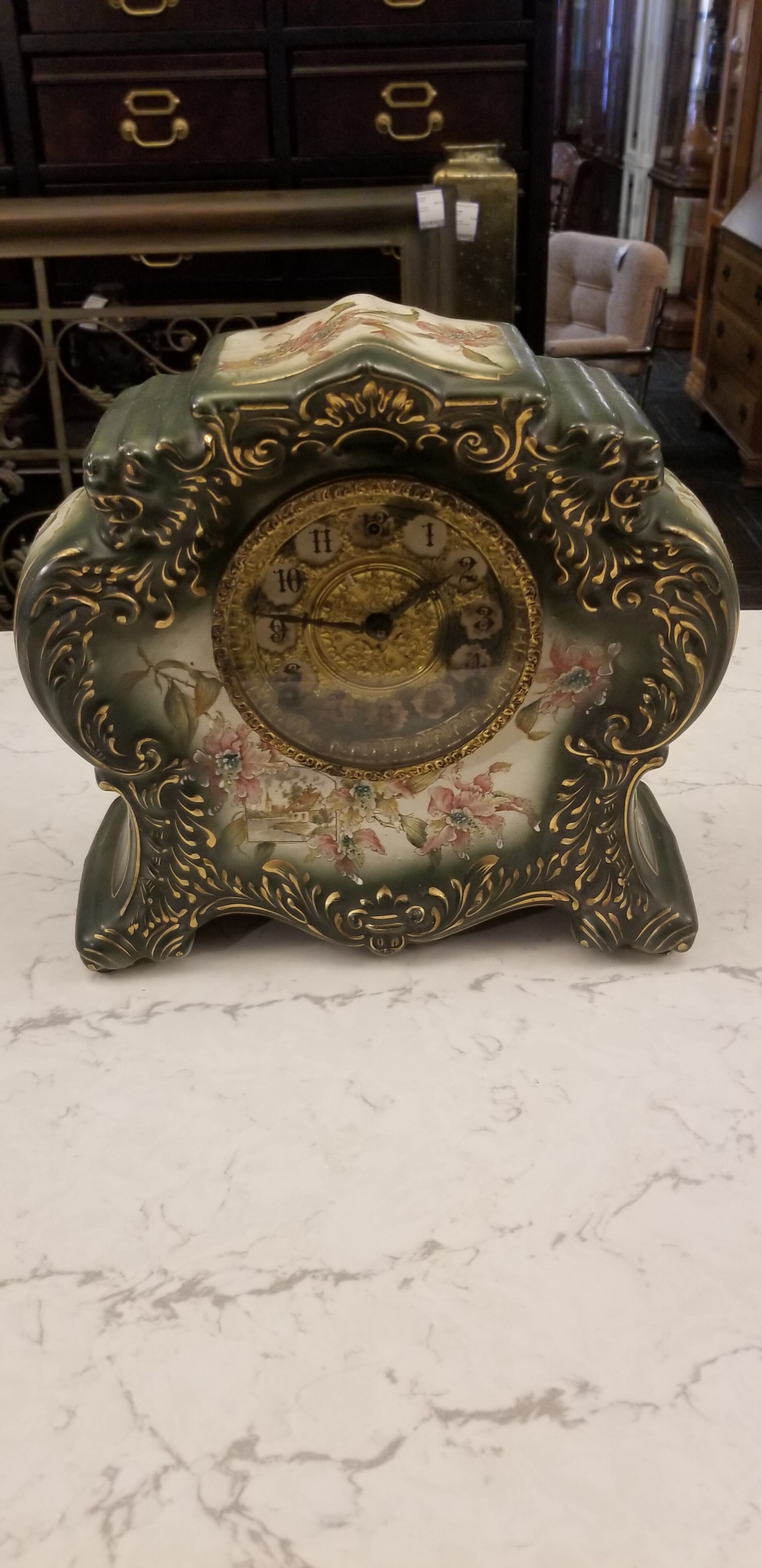 Antique porcelain clock. 12in wide 11in high 5in deep. The clock does not run.