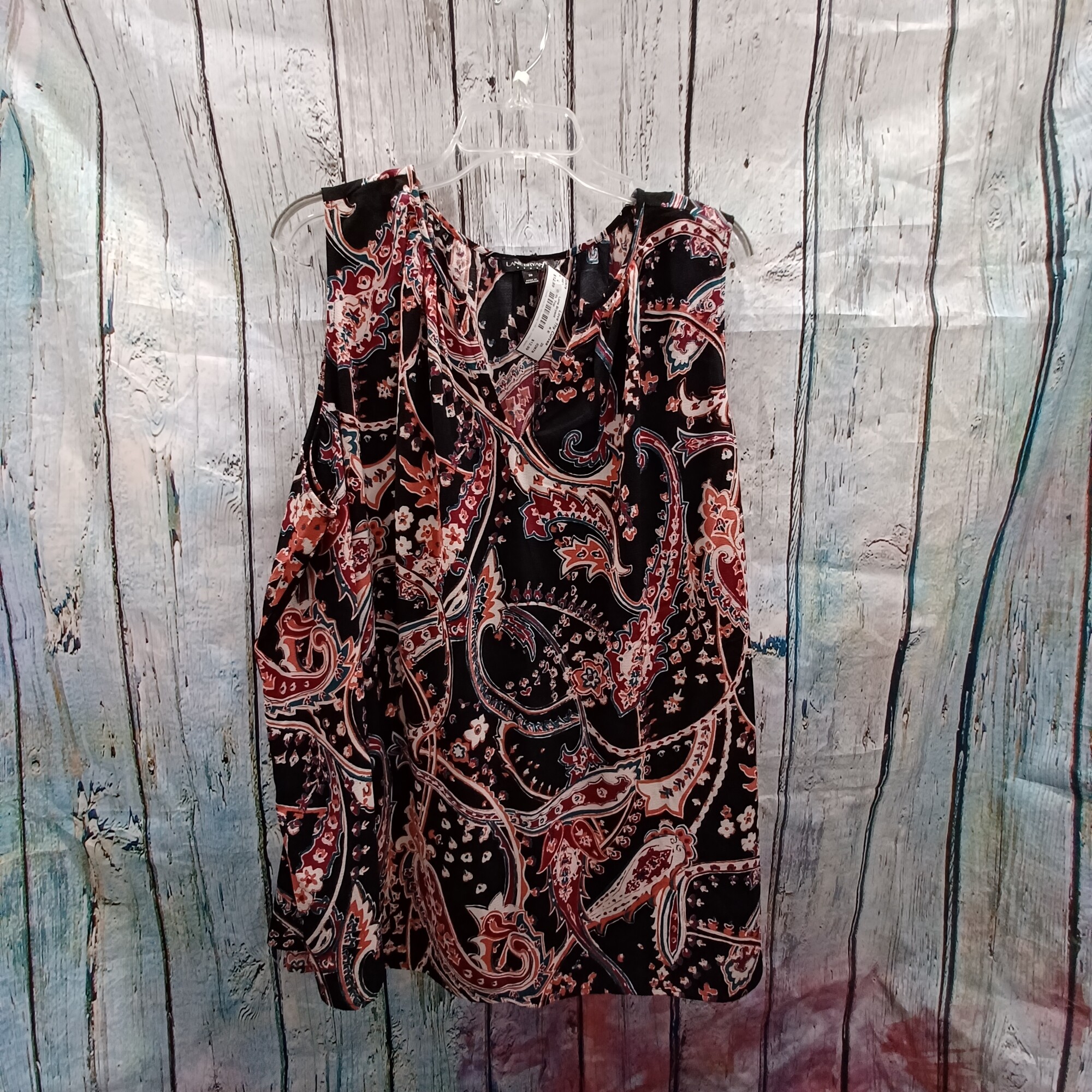 Black sleeveless top with pink, white and teal paisley print