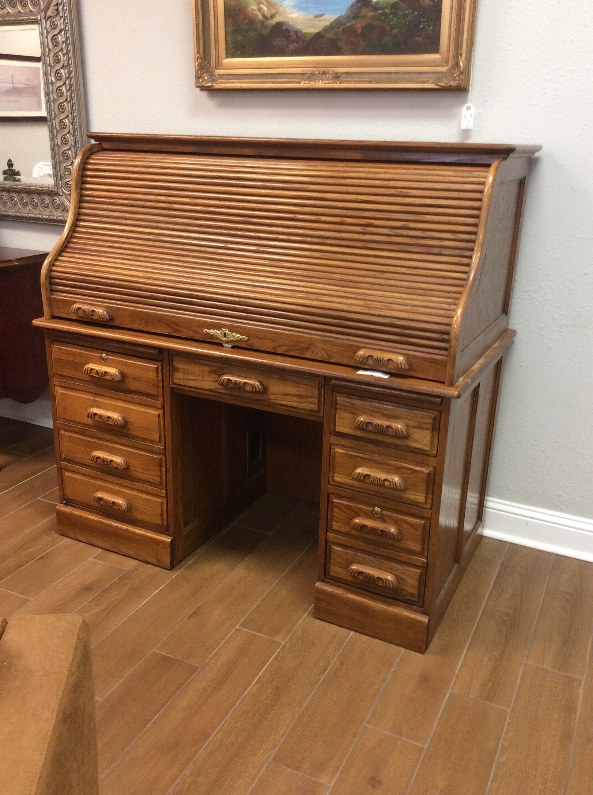These don't last long here, so come by and take a look!
This one is in good condition and includes all of the standard features plus some. There are cubbies, file holders, a pull-out tray, drawers and more. Key included.