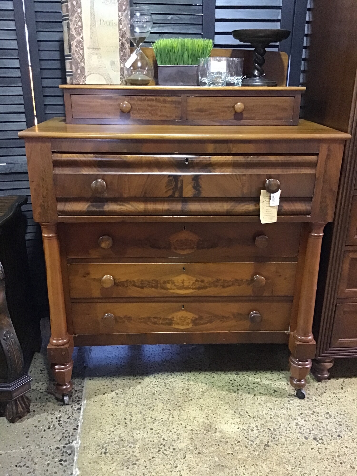 6 Drawer Empire Dresser
Beautiful Antique
Flame mahogany
2 small drawers
1 deep drawer
3 regular drawers
Front pillars Caster wheels

Dimensions: 44x24x56