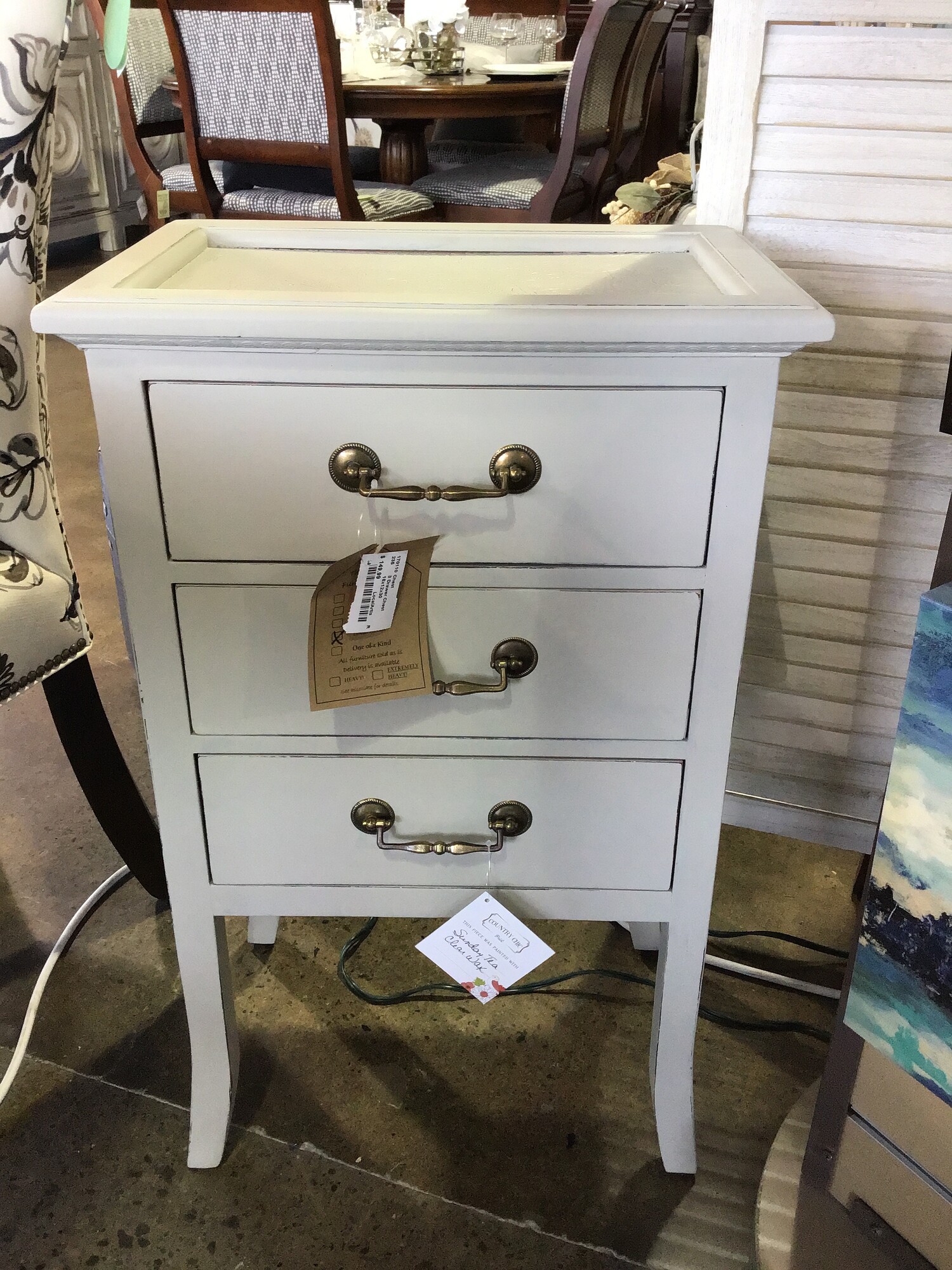 This super functional 3 drawer chest was painted by one of our local artists using Country Chic Sunday Tea paint and clear waxed for protection. It features 3 drawers with bronze handles and a fun patterned top!
Dimensions are 18 in x 12 in x 29-1/2 in