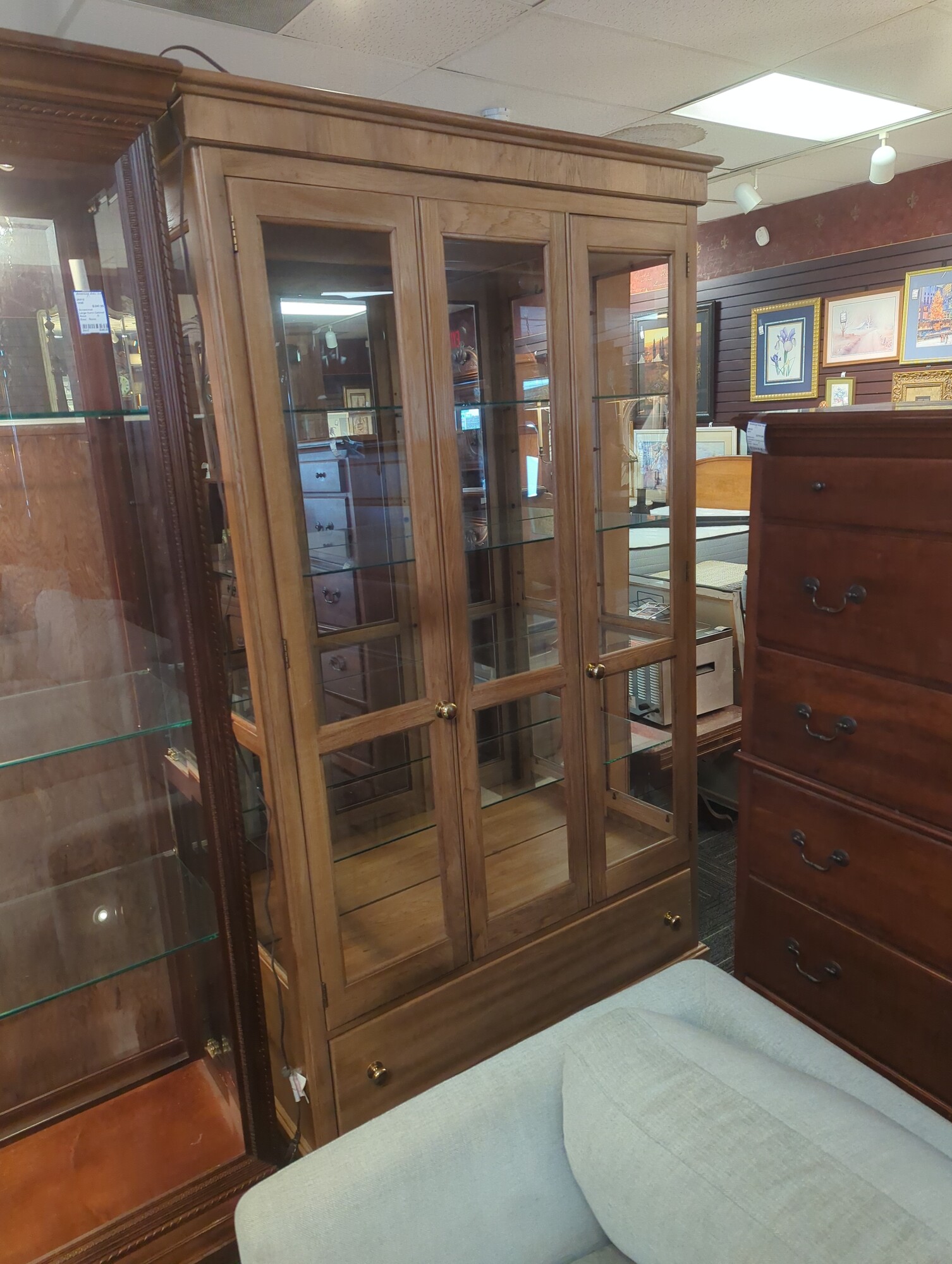 Oak curio cabinet. 48in wide 16in deep 80in high.