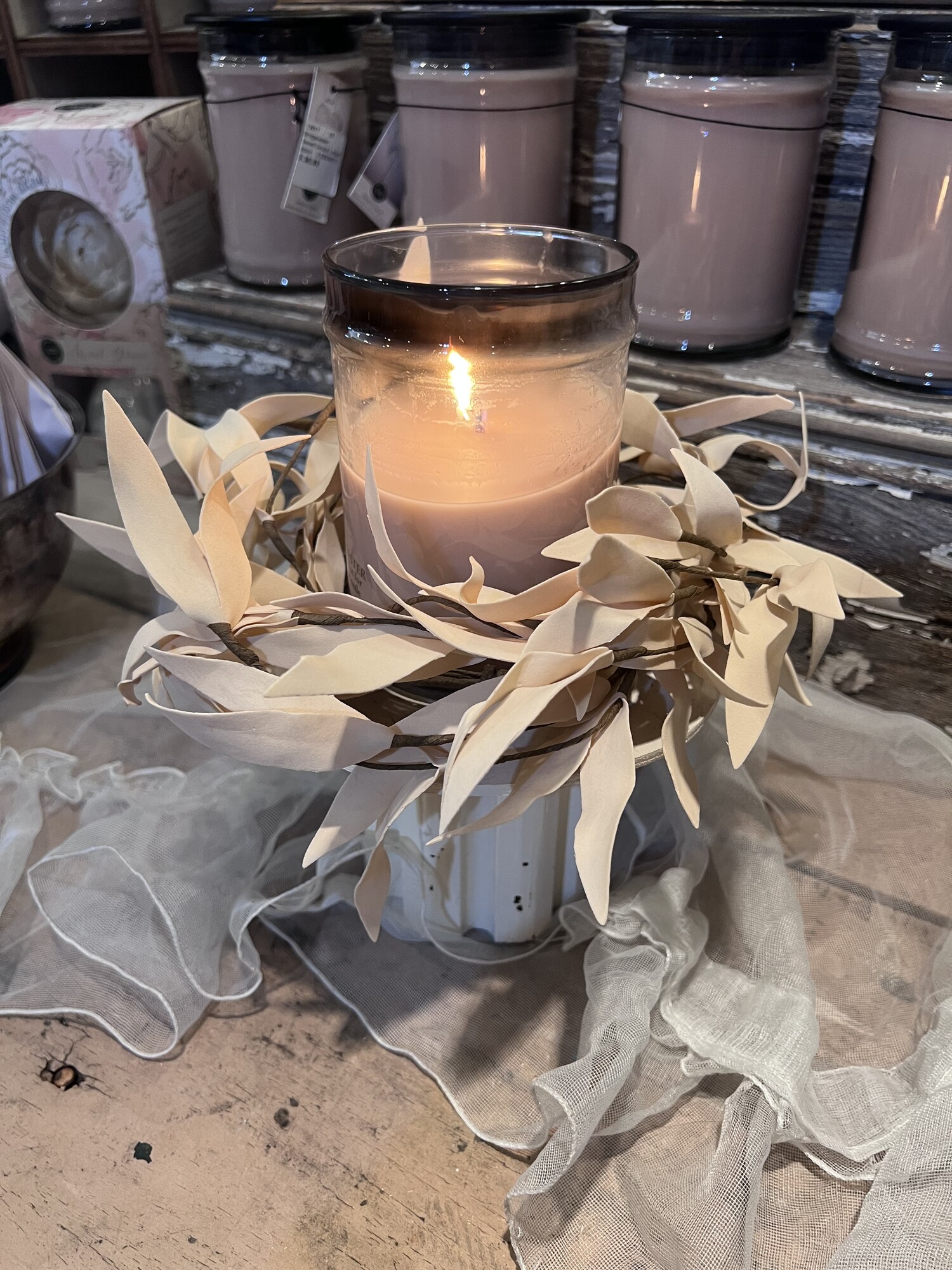 This Biege Leaves candle ring has soft foam leaves in a pretty shade of beige and would look great with any decor. It has a brown paper wrapped inner ring that is 4 inches in diameter and has an outter diameter of 10inches but can be fanned out further. This candle ring perfect for your favorite candle, we love it with our large Sweet Grace candle.