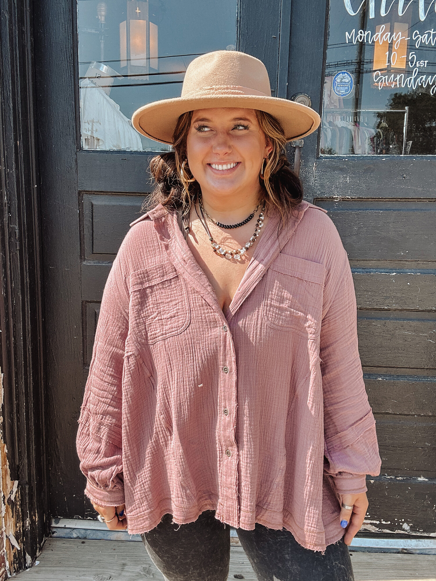 These gorgeous tops come in a lovely mauve color and are made of the very popular gauze material with frayed hems! This is a staple piece!
Madison is wearing a size Large.