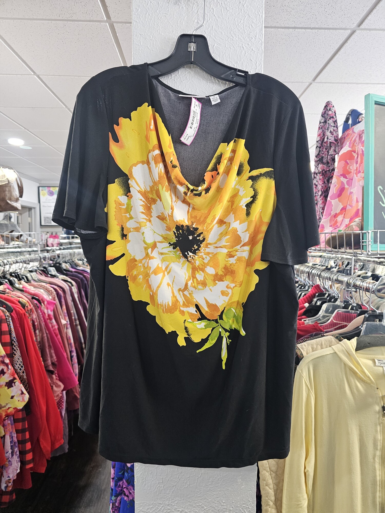 I am a sucker for a bold printed top! This one is sure to please with short sleeves and a beautiful yellow and gold floral graphic