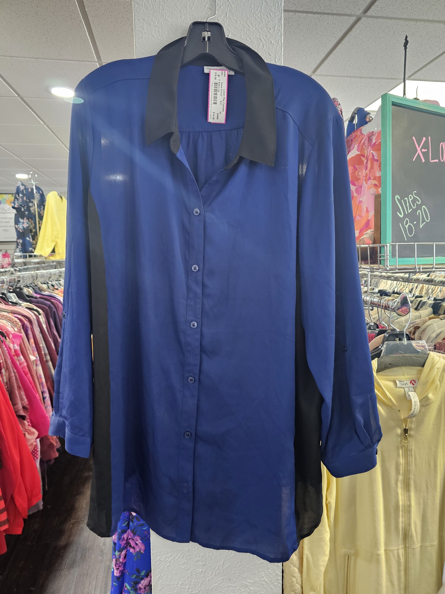 Love this sharp button up blouse in a deep blue and black color. Long sleeves that can be cuffed for versatility.