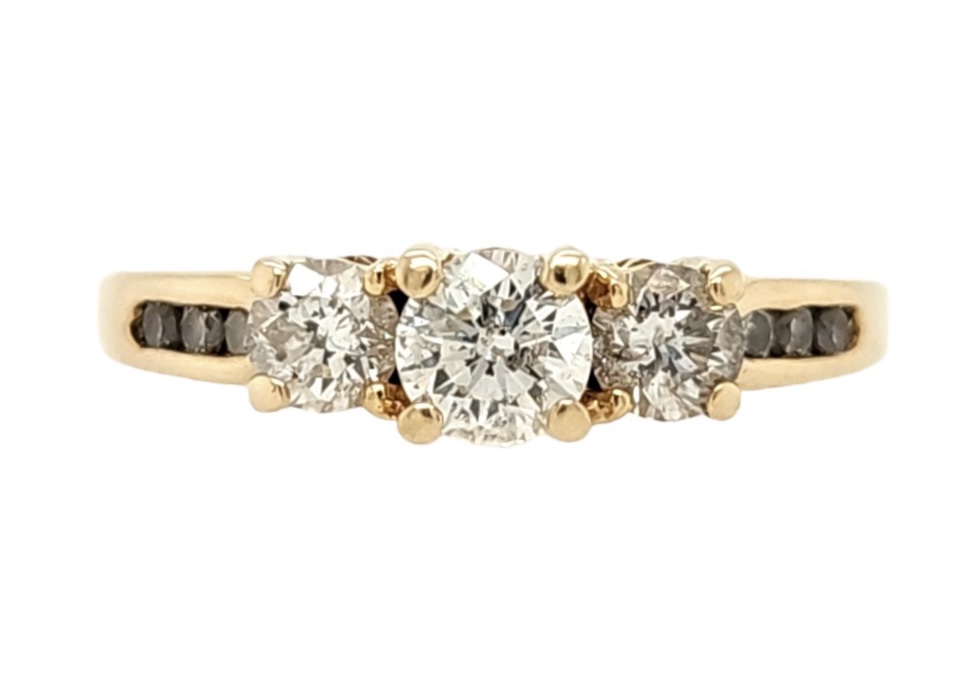 Past Present Future Style Anniversary Band
3 Round Diamonds in Center and 6 Accent Diamonds Channel Set in Band
1/2 Carat Total Weight
14Kt Yellow Gold