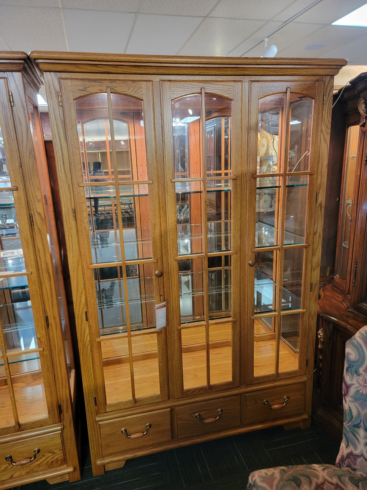Gorgeous Thomasville Display Cabinet in excellent condition.  Qaulity made; well taken care of.   Has three drawers for storage and two doors to open; 3/8' thick plate glass shelves and beveled glassbon front and side doors.  Measures 54' wide; 19' deep; 80' tall.