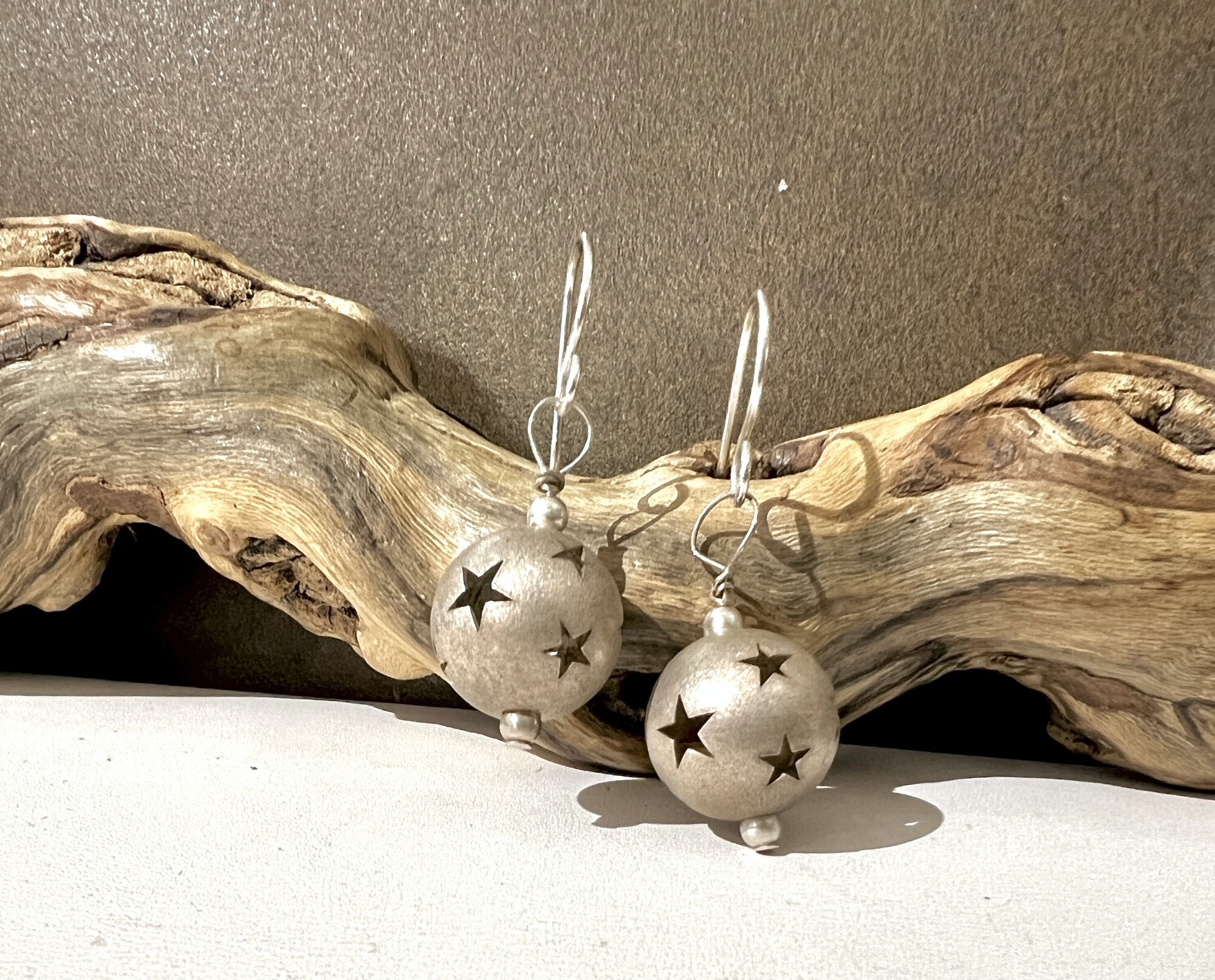 Silver tone star ball earrings